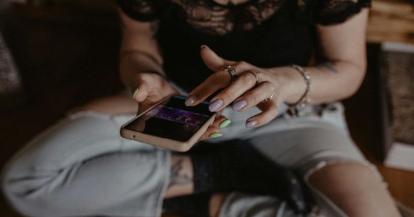 Mum doomscrolling on her phone at night